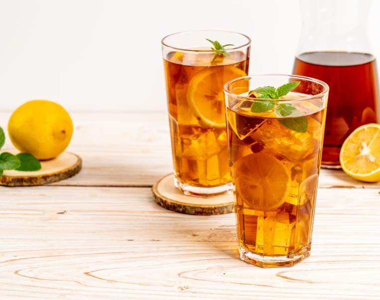 glass of ice lemon tea with mint