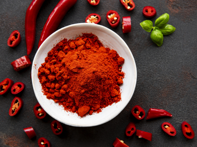 Red chili pepper, dried chillies on dark background. Top view